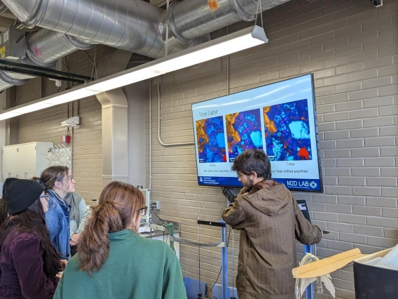 A person giving a presentation to a room full of people.