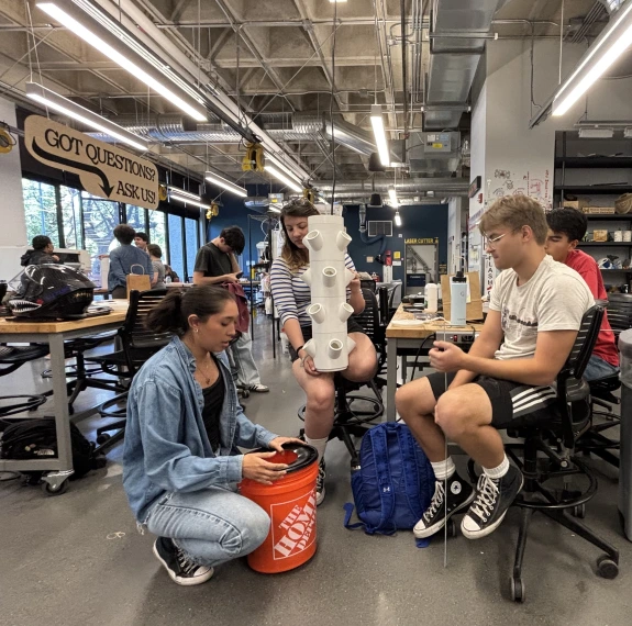 Two members of Makerspace working on a project