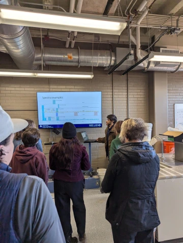A person giving a presentation to a room full of people.